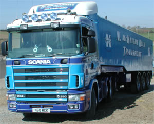 Historic blue McKnight Scania and bulk trailer viewed from the front