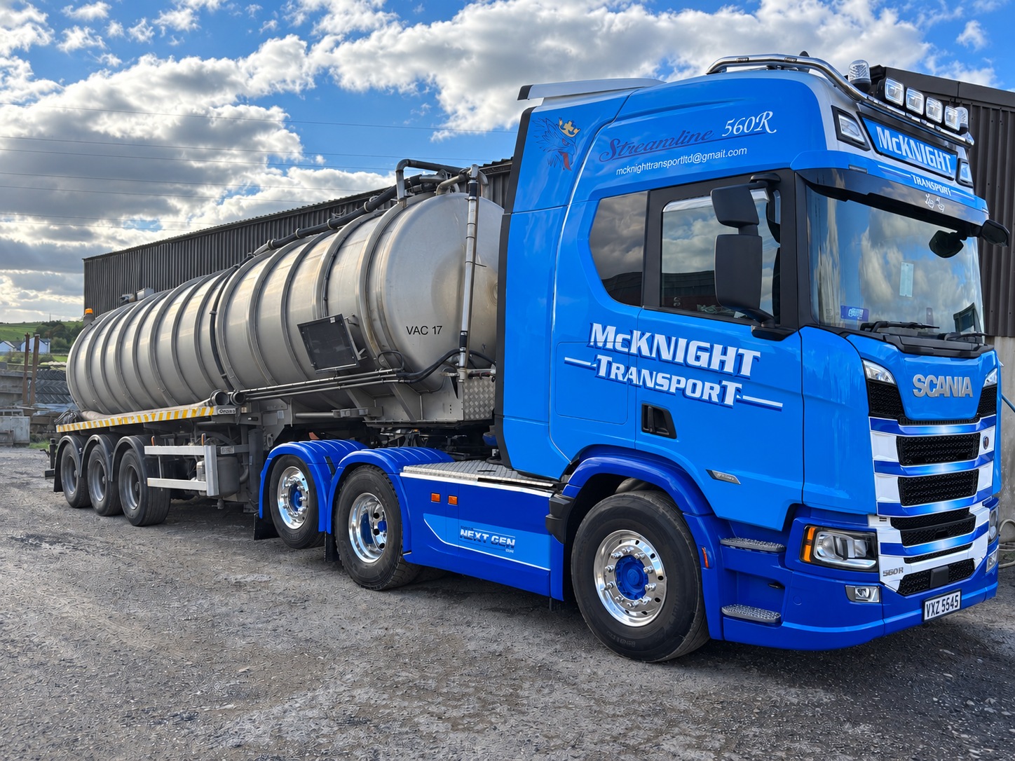Blue McKnight Scania 560R with polished alloy wheels and a stainless steel tanker
