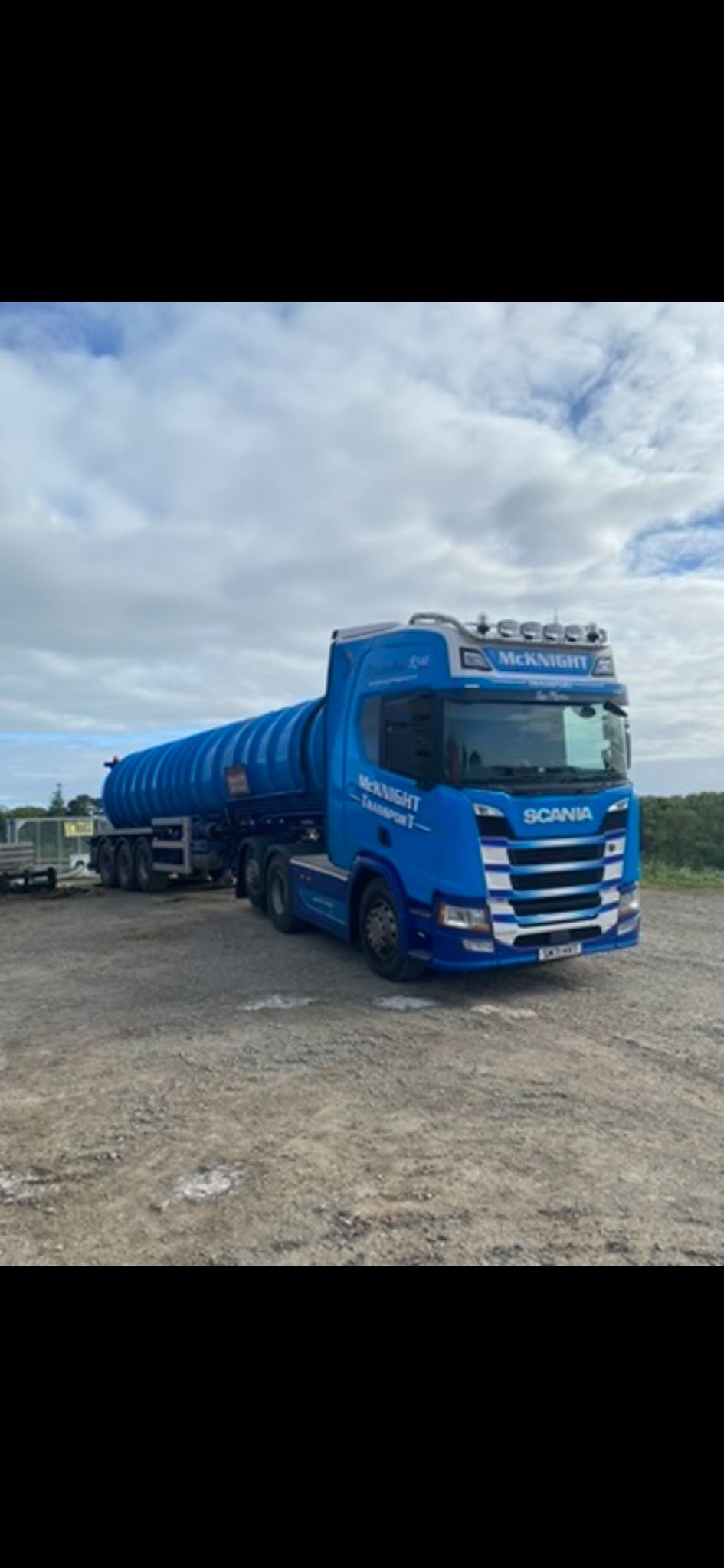 Blue McKnight Scania with a blue tanker trailer